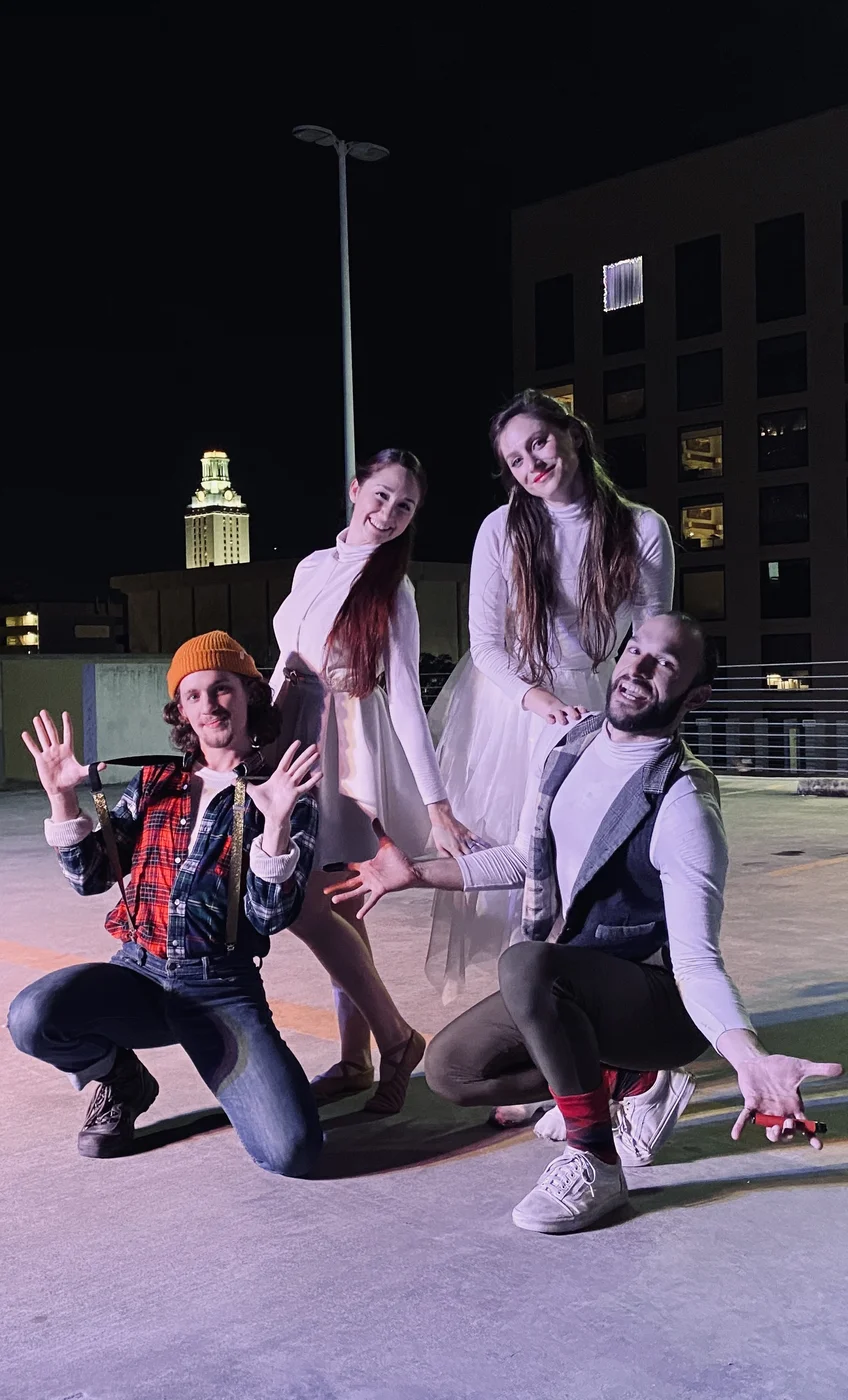 Four performers from The Watchmaker’s Song posing together in costume at the outdoor venue